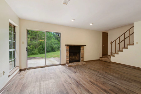 Abita_Springs-Chapman-intr-LR_Stairs_View from Kitchen 